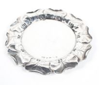 A Victorian trinket dish/card tray, of circular form, with embossed leaf decoration to its border,