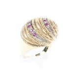 An 18ct yellow and white gold and ruby set 'Snail shell' ring topped with stylised shell set with