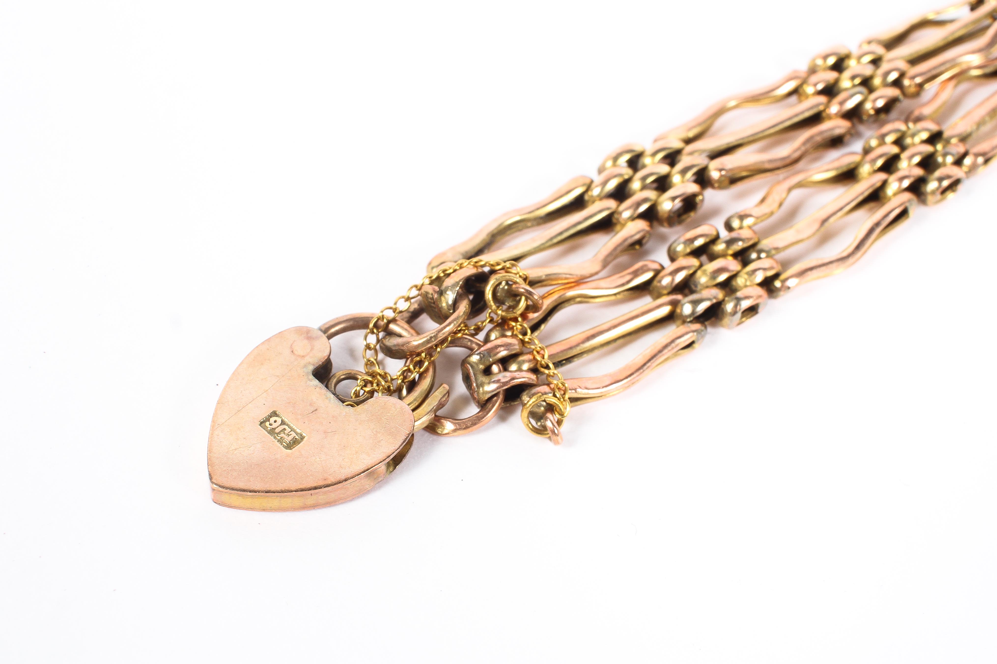 A 9ct rose gold link bracelet with heart padlock, with a yellow metal safety chain 7. - Image 2 of 2