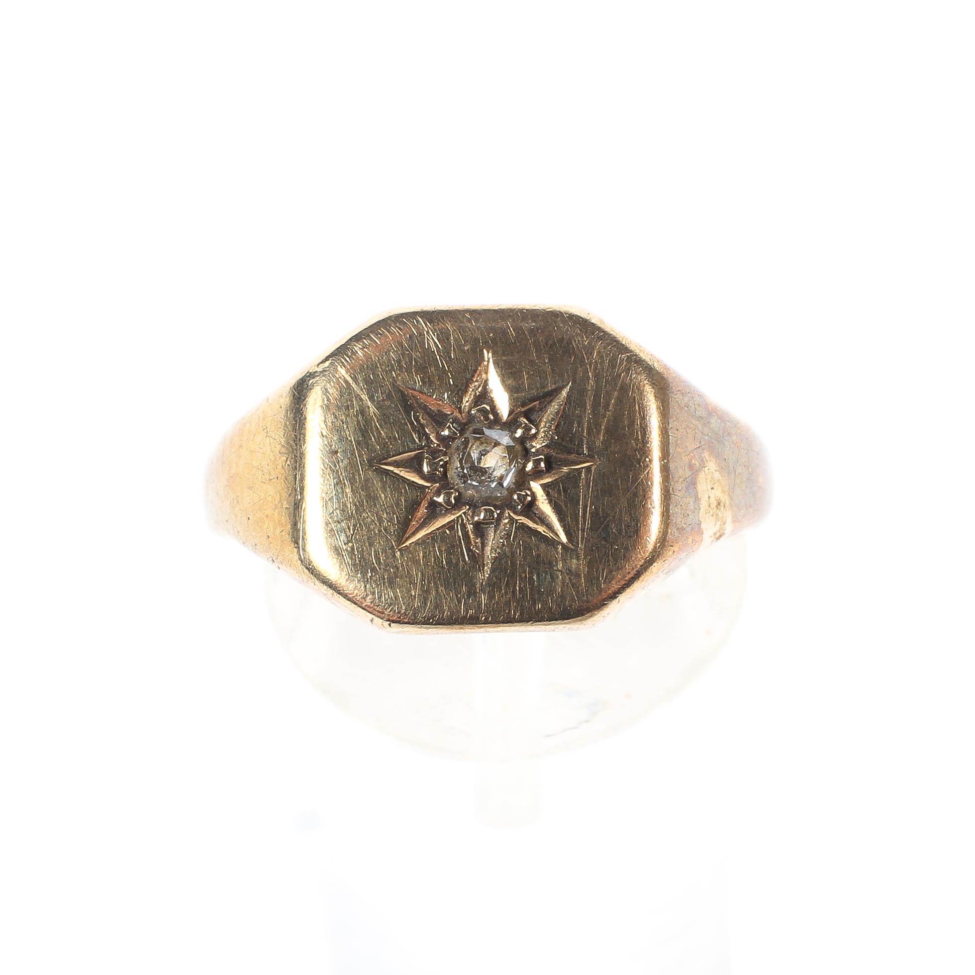 A 9ct yellow gold signet ring, set with a single white stone in a starburst mount to the centre, 3. - Image 2 of 4