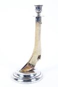 An Edwardian silver mounted deer hoof and leg candlestick,