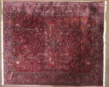 A large room Persian carpet central purple ground and multiple blue boarders 258cm wide x 360cm