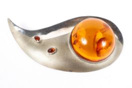 A 1970s unmarked white metal and Amber brooch. Marked verso No1 with indistinct makers mark.