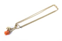 An 18ct gold double flat link necklace with knotted bale and diamond set coral and gold pendants.