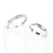 A platinum diamond set half eternity ring together with a platinum wedding band, both size J, 4.