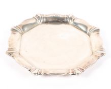 An early 20th century silver card tray, of octagonal form with flowing border,