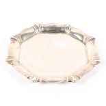 An early 20th century silver card tray, of octagonal form with flowing border,