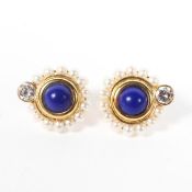 A pair of 18ct gold flower earrings, the central blue stone surrounded by pearls,