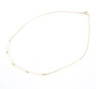 A 9ct gold and freshwater pearl necklace. 38cm. 2.5g.