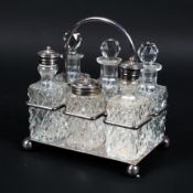 An Edwardian cut glass & silver plate six bottle cruet set