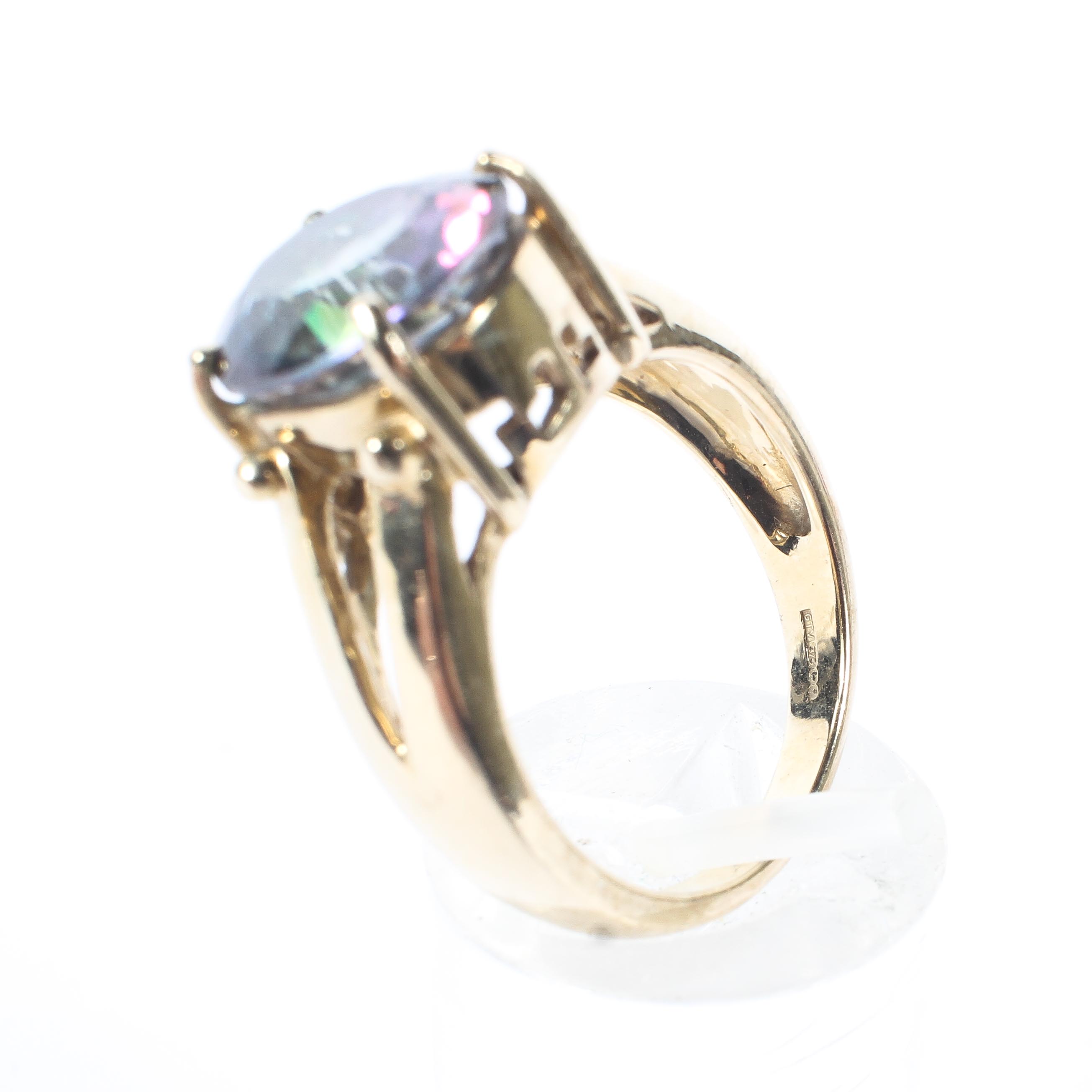 A 9ct gold and Mystic Topaz set dress ring. 5.9g. Size N. - Image 4 of 4