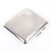 An mid century silver cigarette case, of square form with engine turned decoration throughout,