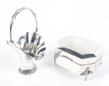 An Edwardian silver basket vase and a George V silver trinket box,