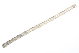 A 9ct gold flat link bracelet with etched Greek key design, 13.