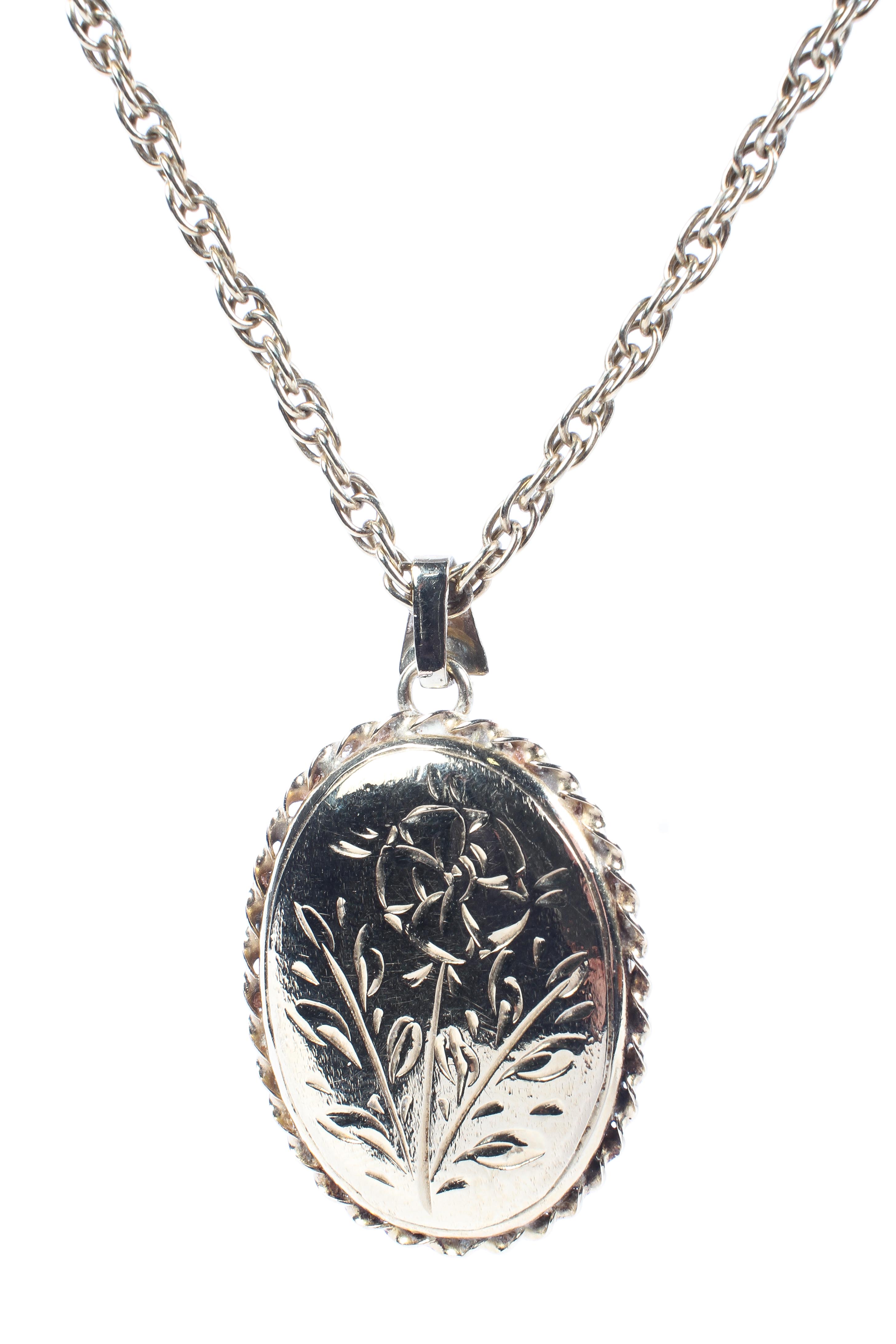 A 9ct gold locket and chain, with engraved floral decoration,