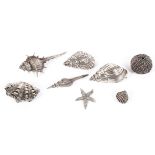 A collection of eight Continental silver and white metal models depicting shells,