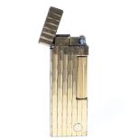 A gold plated Rollagas Dunhill engine turned lighter.