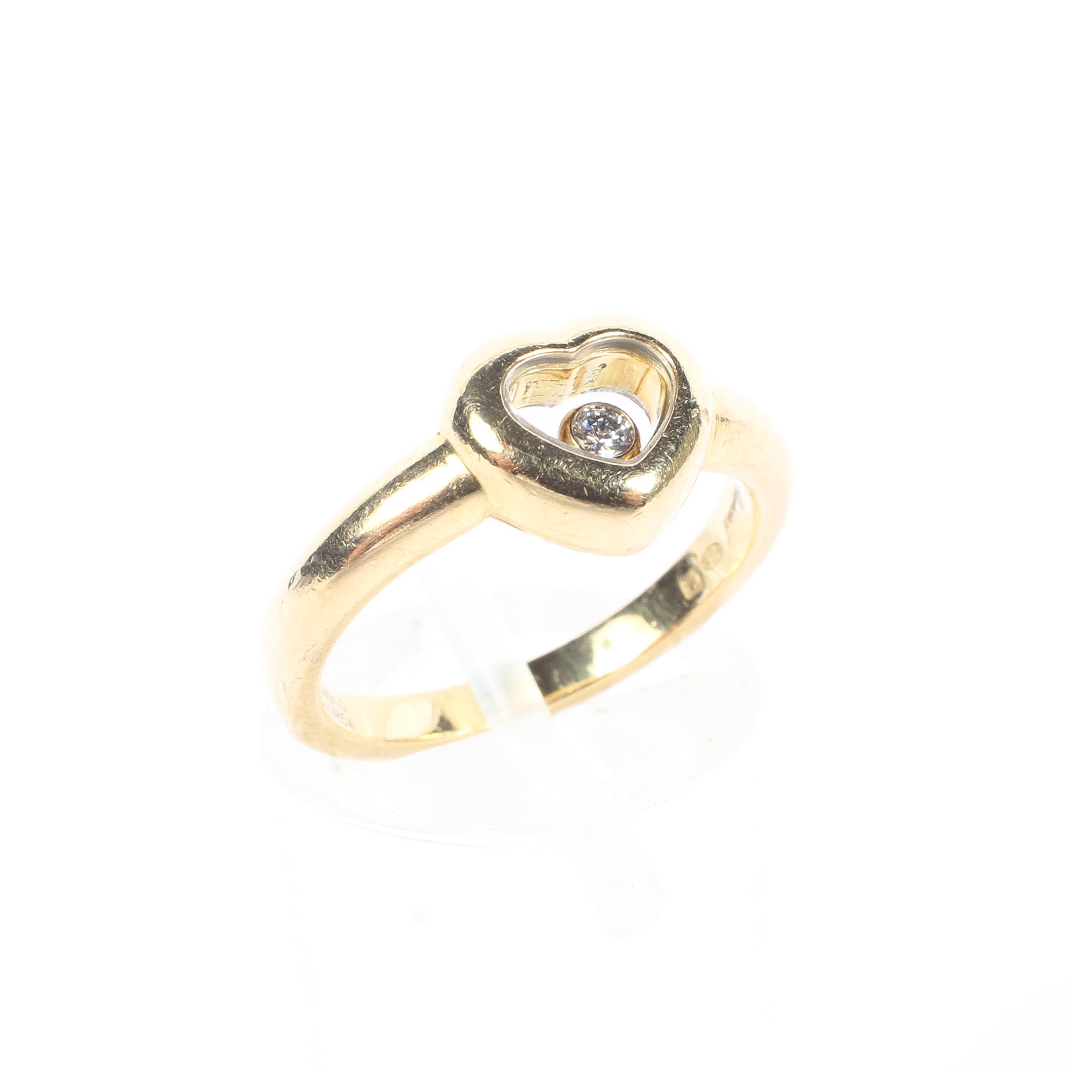 An 18ct gold floating diamond ring, side J, 4.