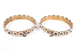 A pair of Indian low grade silver beaded bangles