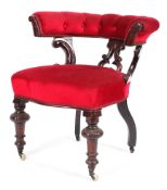 A mahogany button back upholstered armchair on carved supports with castors 77cm wide x 76cm