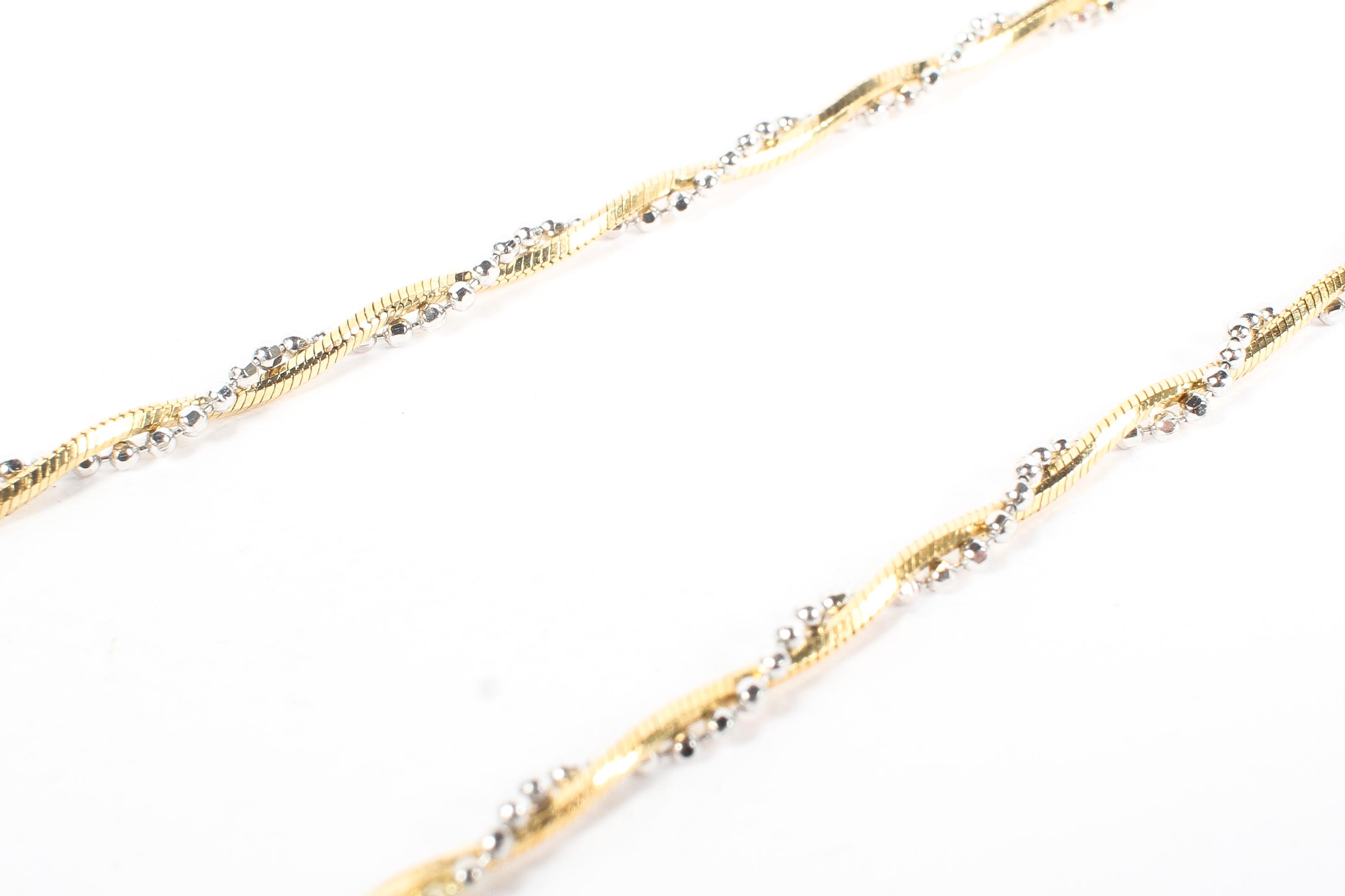 An Italian 18ct white and yellow gold necklace, featuring two intertwining strands of textured gold, - Image 2 of 3