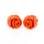 A pair of 14ct yellow gold backed coral earrings, carved in the form of roses, in the original box,