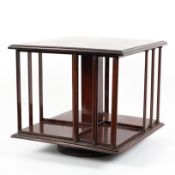 An Edwardian mahogany table top revolving bookcase 37cm length x 37cm wide x 33cm height
