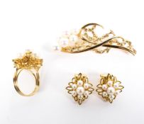 A four piece matching 14ct gold and pearl set, comprising ring, earrings and bar brooch,