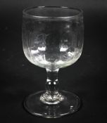 A Continental wine glass, in the 18th century style, the cup-shaped bowl moulded with flutes,