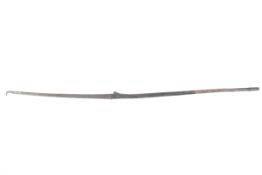A metal mounted wooden spear, decorated with brass studs.