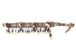 A 20th century Mandau Dayak 'Head Hunters' sword with scabbard,