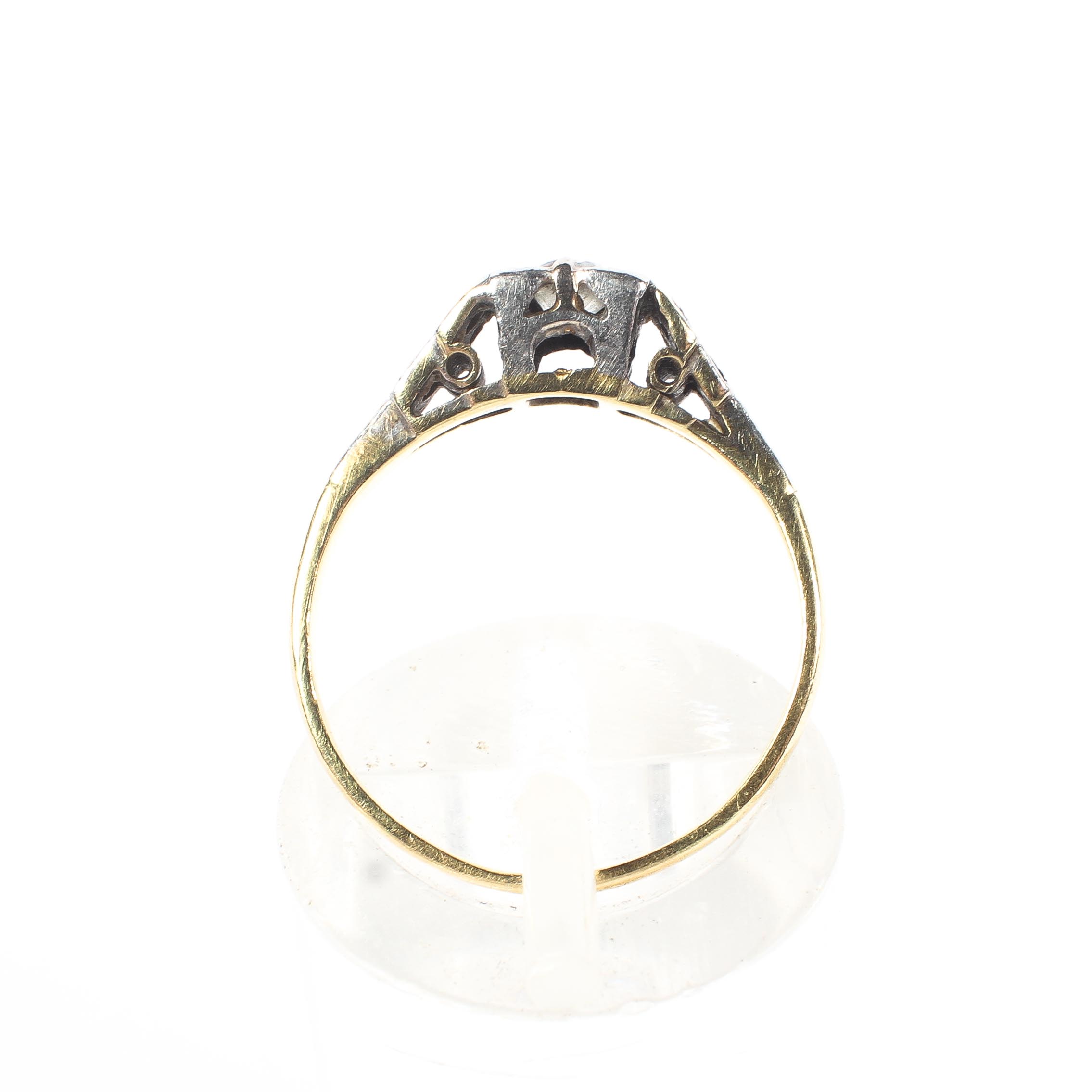 An unmarked yellow and white metal diamond set ring. - Image 3 of 3