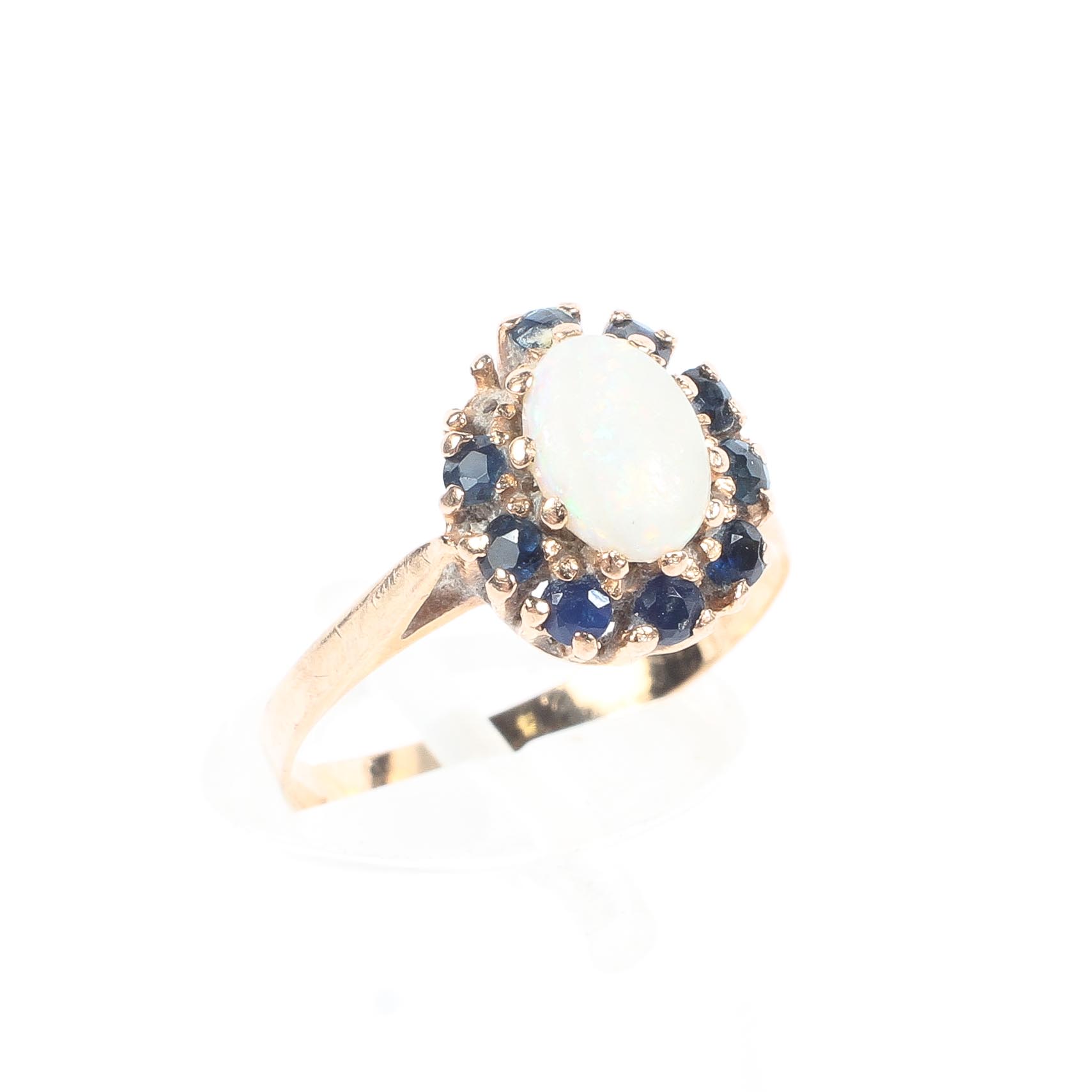 A 15ct gold opal and sapphire dress ring, (one sapphire missing), size M, 1.