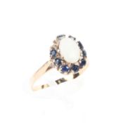 A 15ct gold opal and sapphire dress ring, (one sapphire missing), size M, 1.