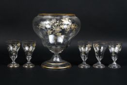 A large glass gilt and enamel decorated vase with matching glasses