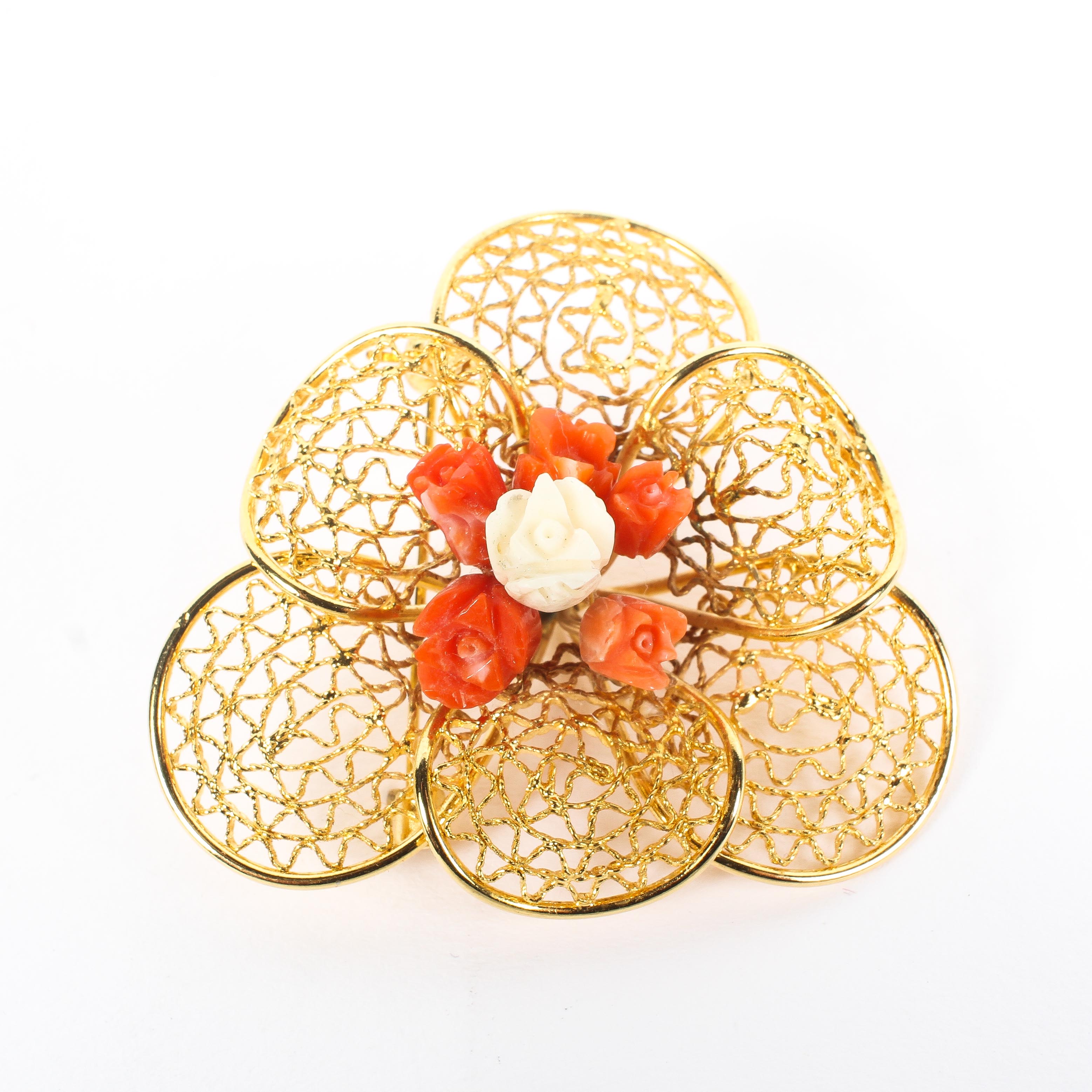 A contemporary 18ct yellow gold (unmarked) and coral brooch,