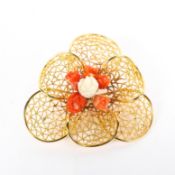 A contemporary 18ct yellow gold (unmarked) and coral brooch,