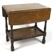 A 20th century mahogany drop leaf table, with curved edges,