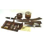 A collection of Military wares, including a WWI toolkit knife, toolkit,