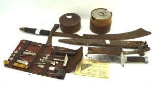 A collection of Military wares, including a WWI toolkit knife, toolkit,