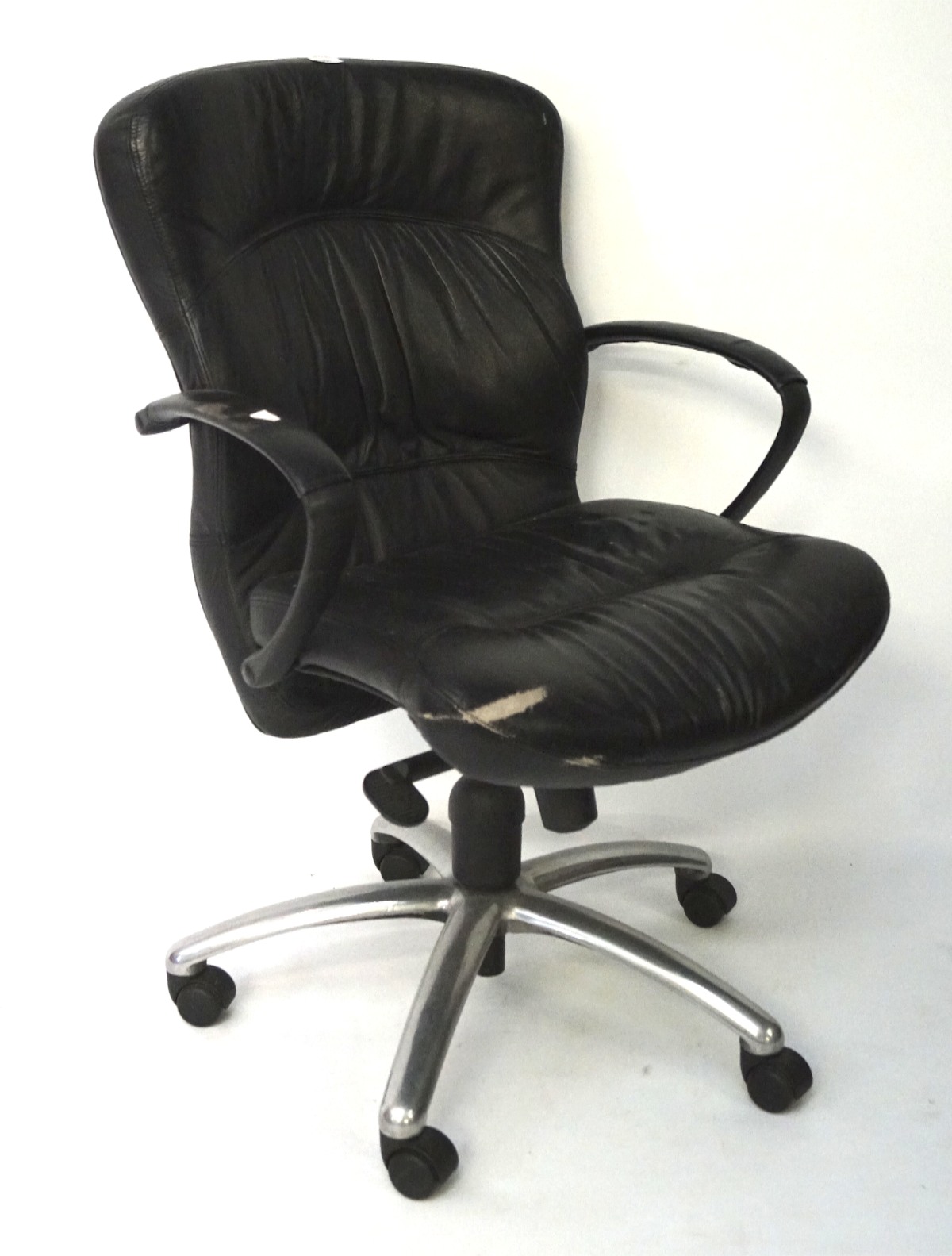 A black leather office chair, of adjustable height with a chrome base, on castors,