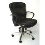 A black leather office chair, of adjustable height with a chrome base, on castors,