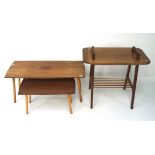 A group of three retro tables, two being matching, nest form, on graduating supports,