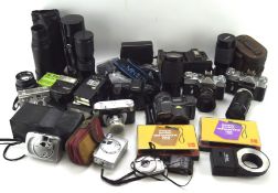 A collection of assorted cameras, binoculars and related wares,