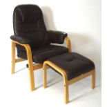 A contemporary stressless style armchair with matching footstool,