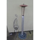 Garden metal standing plant holder, height 111cm, and a garden lamp,