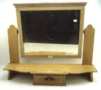 A pine dressing table top section with bevelled swing mirror above a small central drawer,