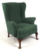 A Victorian rocking chair and winged back armchair,