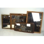 Four contemporary wood framed mirrors of various sizes,