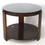 A vintage vaneered coffee table, of circular form, with glass top,